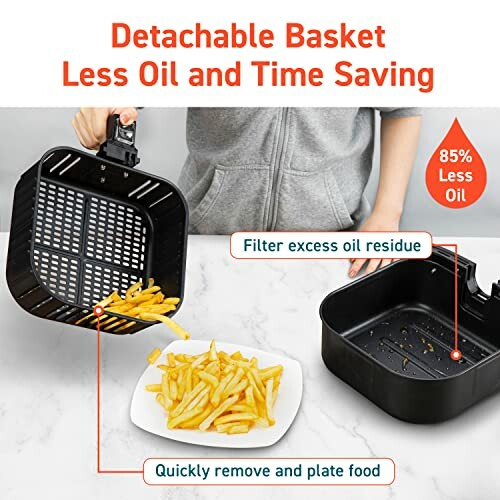 Person demonstrating detachable air fryer basket with fries on a plate.